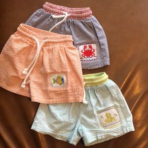 Lot of 3 smocked swim trunks.